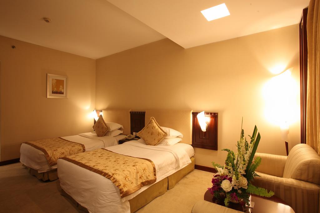 Beijing Wuhuan Hotel Номер фото
