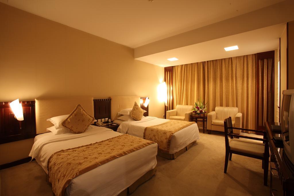 Beijing Wuhuan Hotel Номер фото