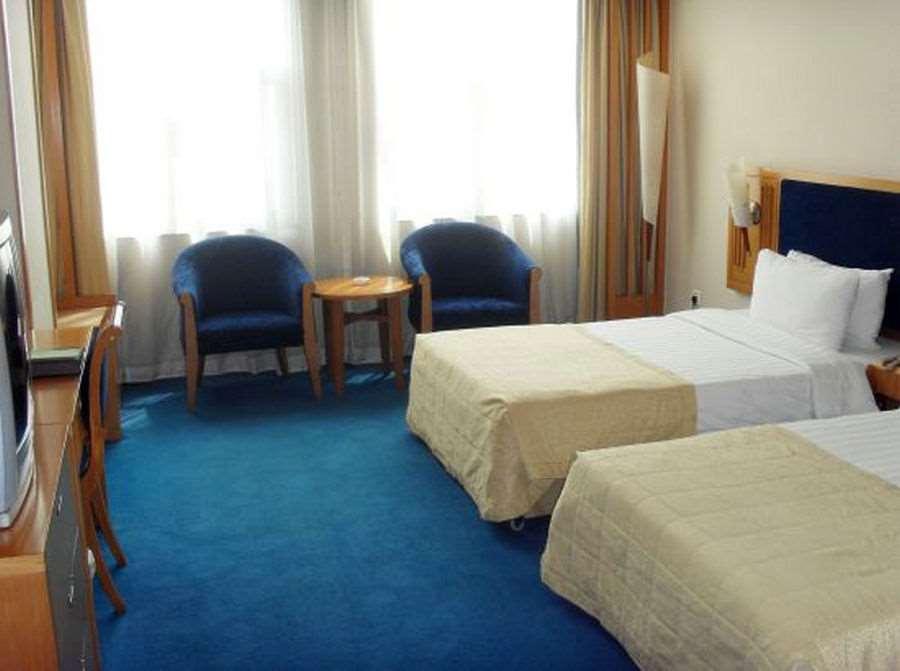Beijing Wuhuan Hotel Номер фото