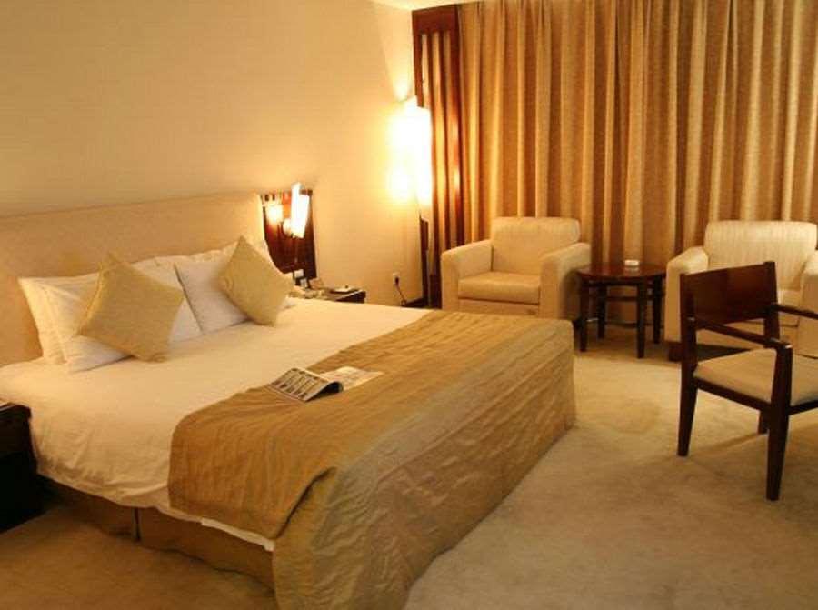 Beijing Wuhuan Hotel Номер фото