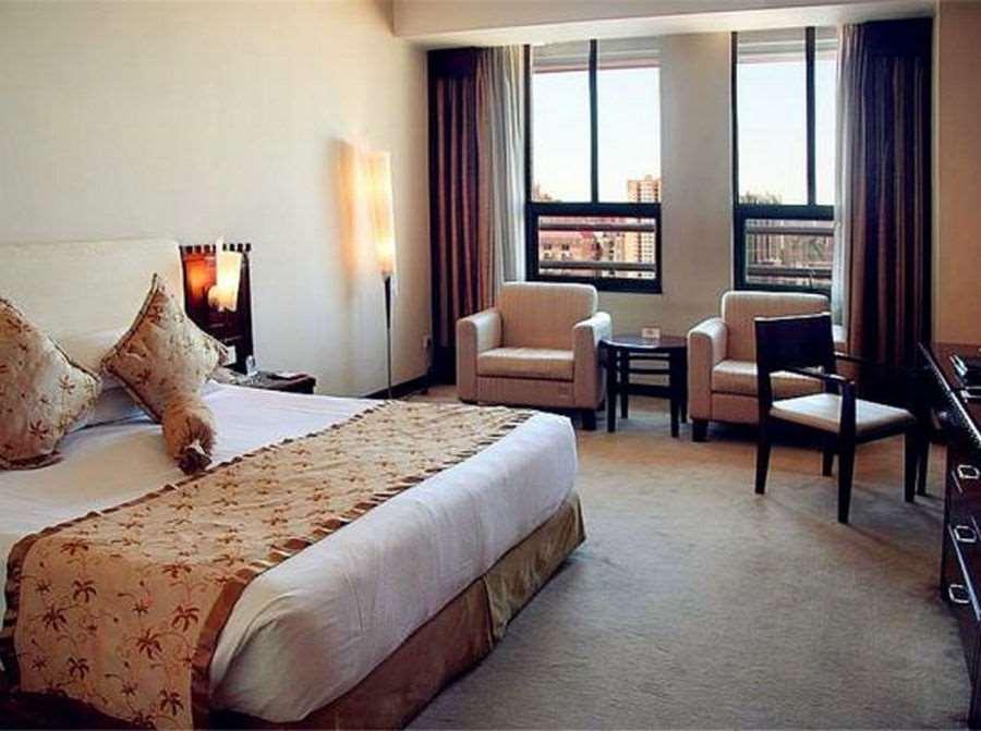 Beijing Wuhuan Hotel Номер фото